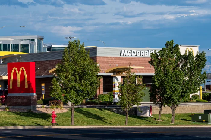 McDonald’s restaurant exterior beside a road on a sunny day
